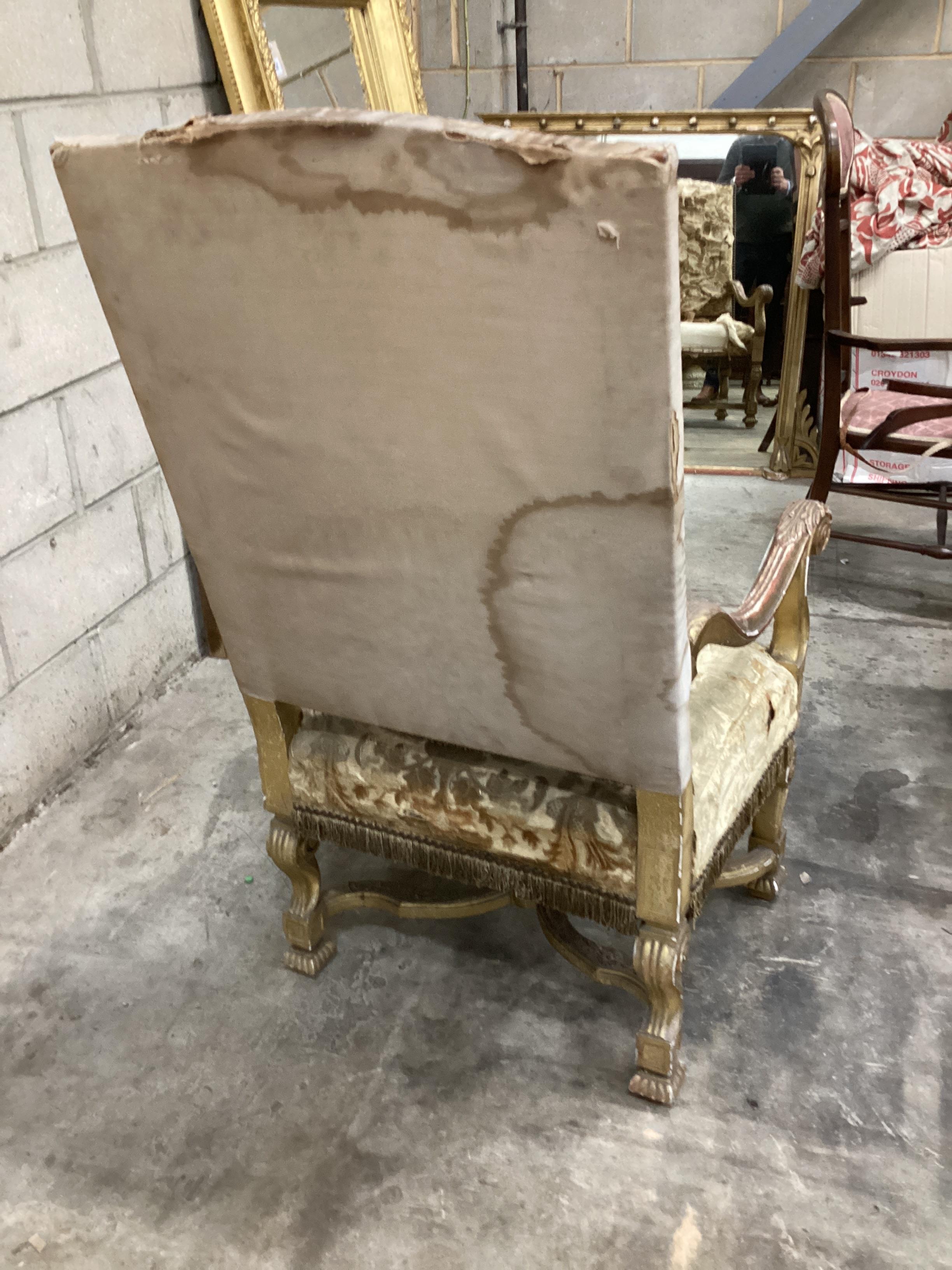 A Louis XIV style carved giltwood armchair, width 66cm, depth 64cm, height 118cm